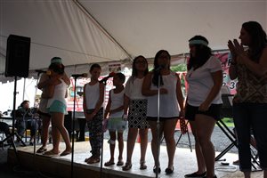Glee class performing at a festival